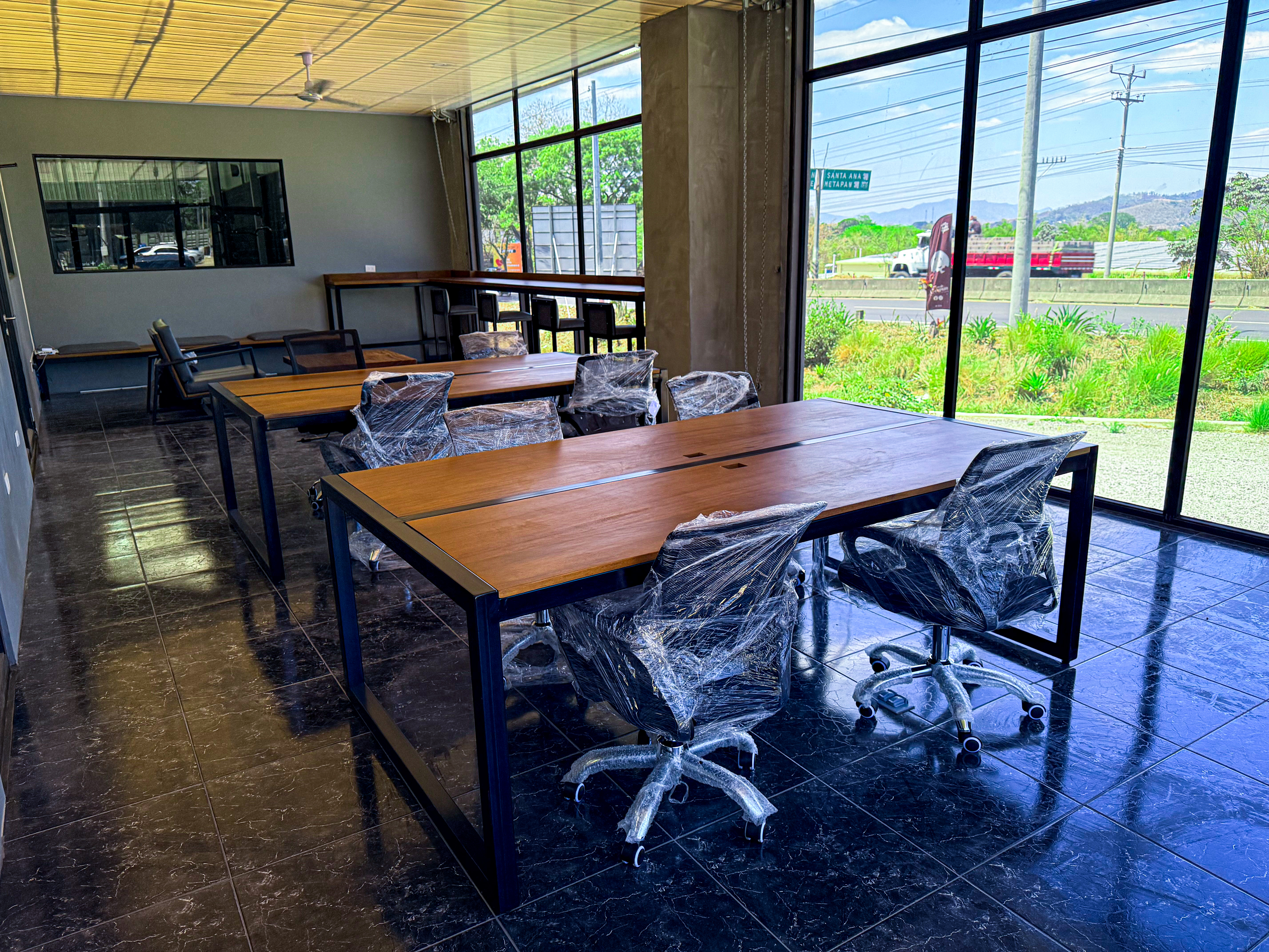 Coworking workspace with standing desks and mountain views